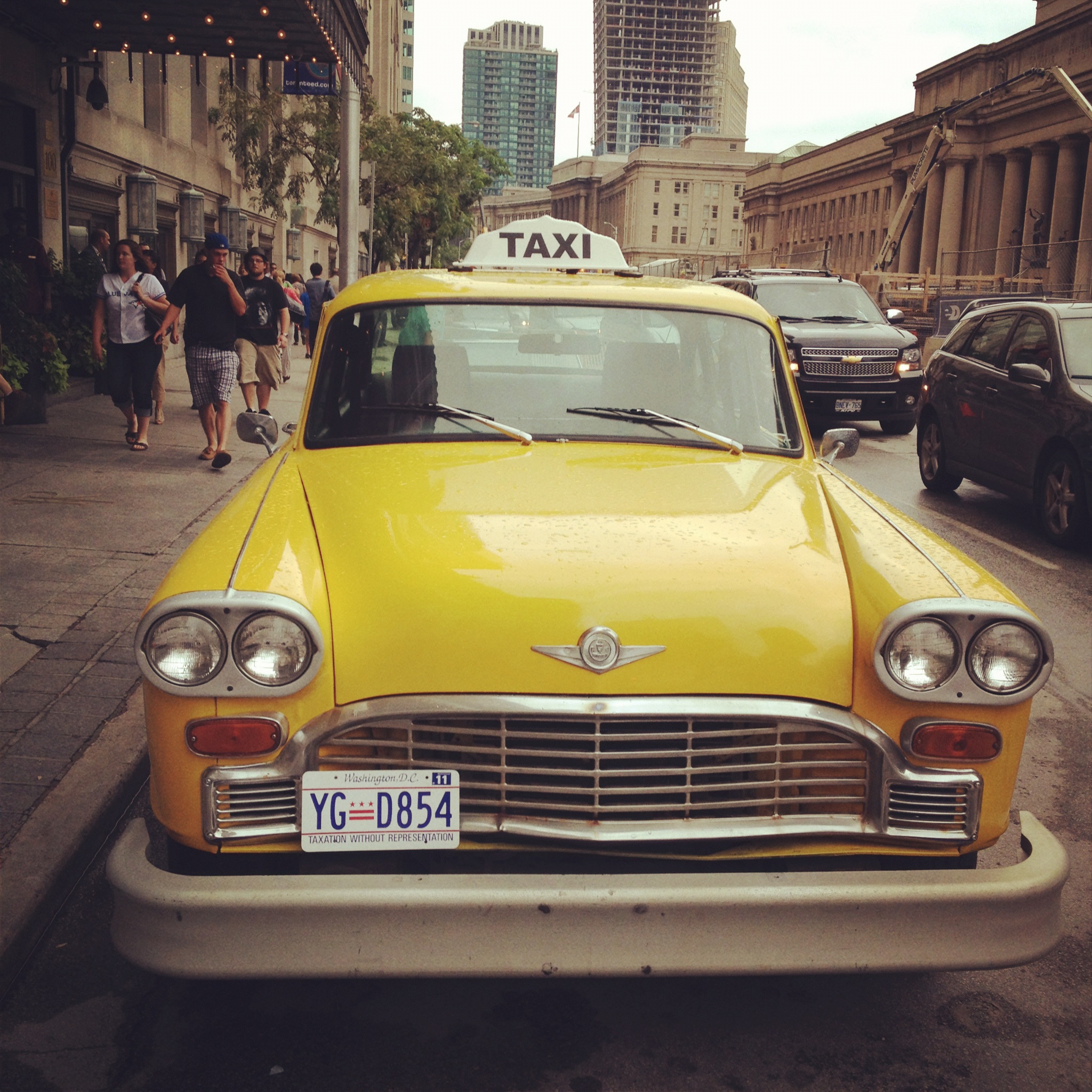 Cool vintage taxi parked outside of The Fairmont Royal York during the conference.